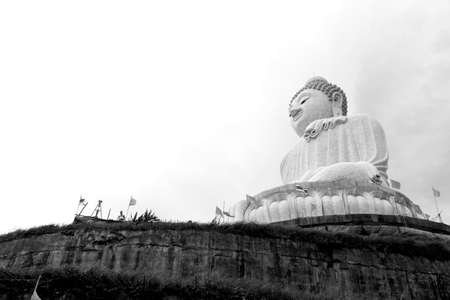 BIG BUDDHA PARK, PHUKET, THAILAND FEBRUARY 15 2013: Western tourist stands under the Big Buddha Statue on Phuketのeditorial素材
