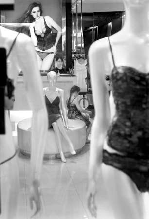 PHUKET, THAILAND, 22 JUNE 2012: A little girl plays in a lingerie store.のeditorial素材
