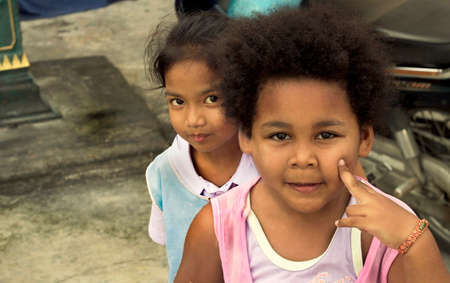 PHUKET, PATONG, 21 MAY 2012: Neighborhood kids mug for the camera in Phuket, Thailand.のeditorial素材