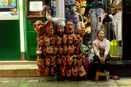 BANGLA RD., PATONG, PHUKET, THAILAND, 28 MAY 2012: A street peddler sells Halloween and party masks on Soi Bangla.のeditorial素材