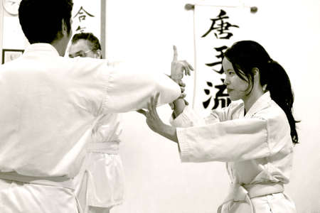 PHUKET TOWN, PHUKET, THAILAND, 3 MARCH 2014: Students of Aikido perform techniques on the mat during a promotion test.のeditorial素材