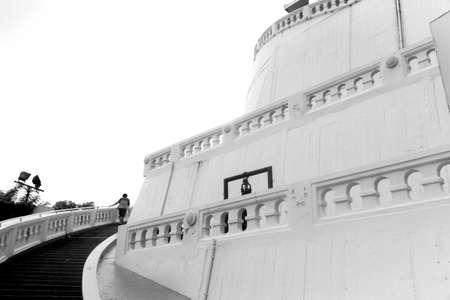 TEMPLE OF THE GOLDEN MT., BANGKOK, THAILAND, 28 SEPTEMBER 2014: A Thai woman climbs up the stairs leading to the top of the Golden Mt. Temple.のeditorial素材