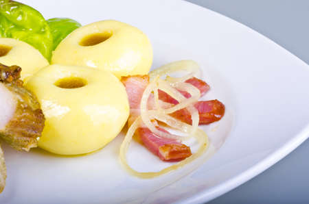 Silesian potato dumplings with duck and fresh saladの写真素材