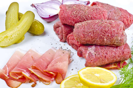 Rouladen  are a German meat roulade usually consisting of bacon, onions, mustard and pickles wrapped in thinly sliced beef which is then cooked.の写真素材