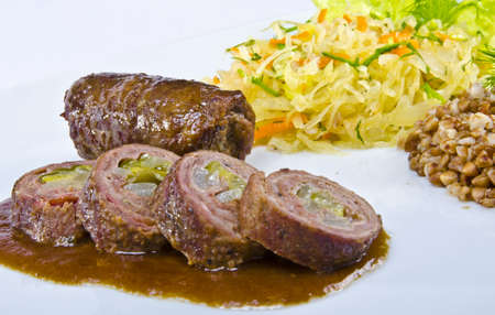 Rouladen  are a German meat roulade usually consisting of bacon, onions, mustard and pickles wrapped in thinly sliced beef which is then cooked.の写真素材