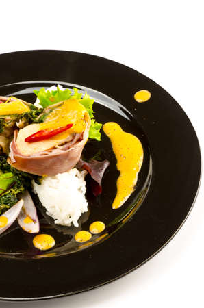 Salmon in ham covers and spinachの写真素材
