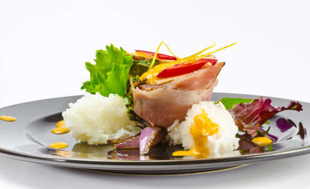 Salmon in ham covers and spinachの写真素材