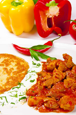 Hungarian goulash with potato pancakesの写真素材