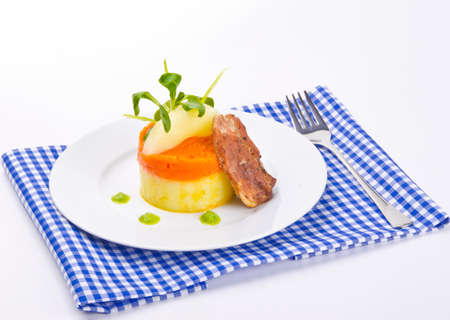carrots tureen with mashed potatoes and meatの写真素材