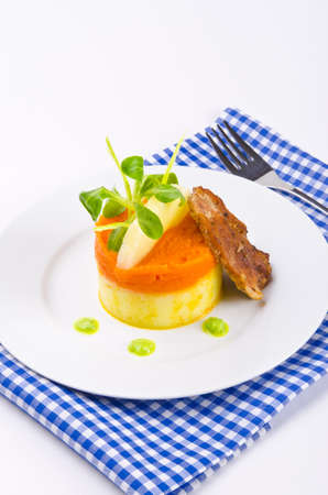 carrots tureen with mashed potatoes and meatの写真素材