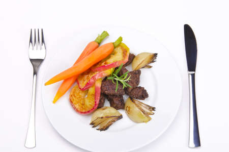 roasted liver with vegetables and appleの写真素材