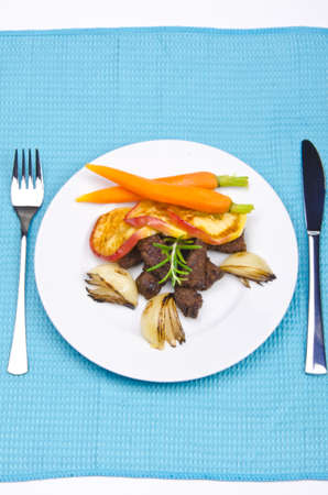 roasted liver with vegetables and appleの写真素材
