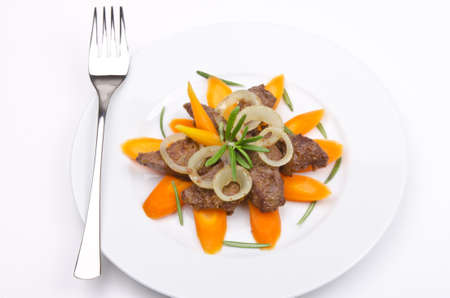 roasted liver with vegetables and appleの写真素材