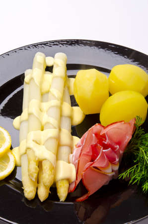 Asparagus, ham and sauce hollandaiseの写真素材