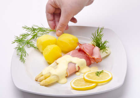 Asparagus, ham and sauce hollandaiseの写真素材