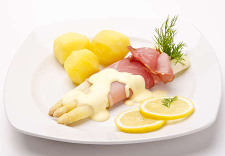 Asparagus, ham and sauce hollandaiseの写真素材