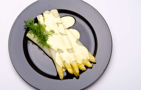 Asparagus, ham and sauce hollandaiseの写真素材