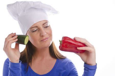 Woman with paprika and cucumberの写真素材