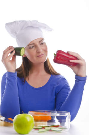 Woman with paprika and cucumberの写真素材
