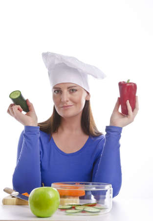 Woman with paprika and cucumberの写真素材