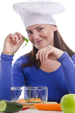 Woman with paprika and cucumberの写真素材