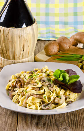 Tagliatelle with tail steak stripe and champignonsの写真素材