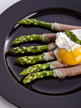 Asparagi with fried eggの写真素材