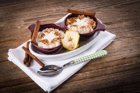 milk rice with cinnamon and applesauceの写真素材
