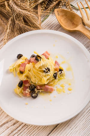 tagliatelle with bacon and blacken to olive onesの写真素材
