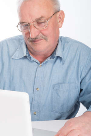 Mature man with laptopの写真素材