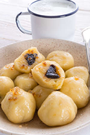 Potato dumplings with plums fullの写真素材