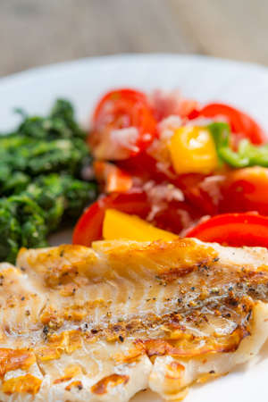 salmon sheet spinach tomatoの写真素材