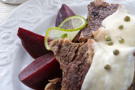 Beef with beetroot and horseradish sauceの写真素材