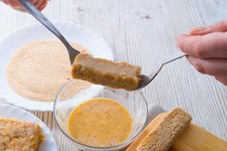 home-baked fish sticks with salad の写真素材