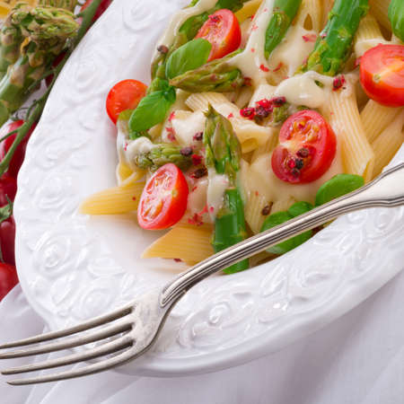 Noodles with asparagus in cream-cheese sauceの写真素材