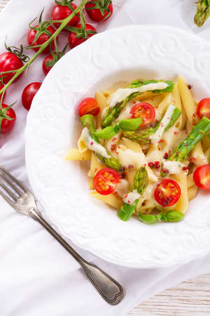 Noodles with asparagus in cream-cheese sauceの写真素材