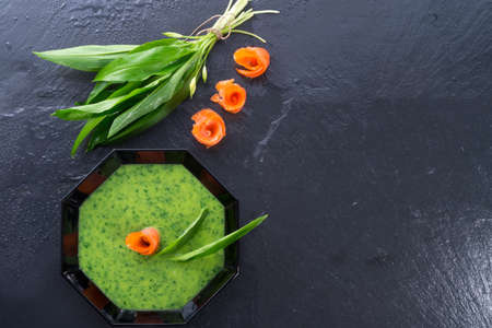 Bear allium soup with smoking salmon