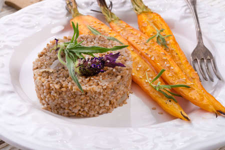 Wheat groats  and Caramelized carrots の写真素材
