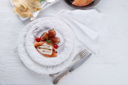  flambe pancakes with figs and cherriesの写真素材