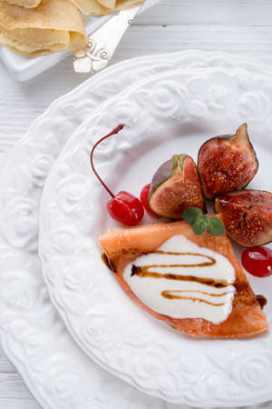  flambe pancakes with figs and cherriesの写真素材