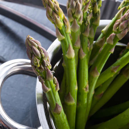 Green asparagus in the potの写真素材