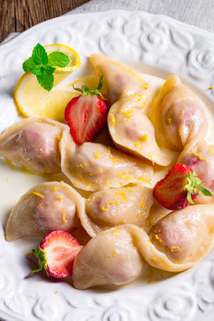 pierogi with strawberriesの写真素材