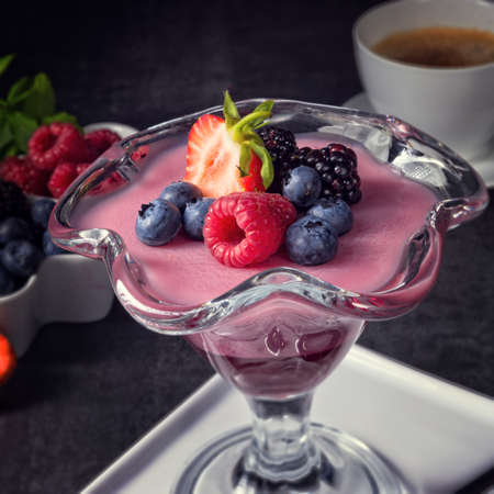 delicious pudding with wild berryの写真素材