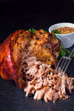 fresh roasted knuckle of pork with mustardの写真素材