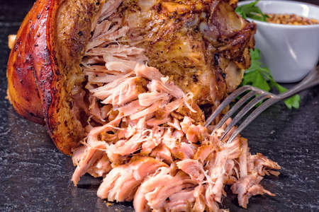 fresh roasted knuckle of pork with mustardの写真素材