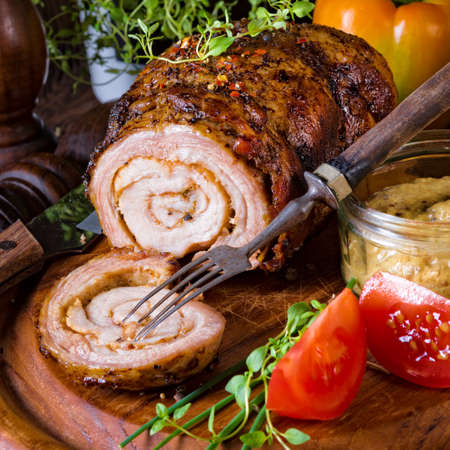 Rolling roasts fullly with dried fruit and baconの写真素材