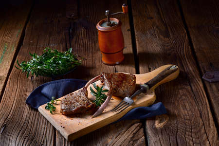 Grilled lamb chops an old boardの写真素材