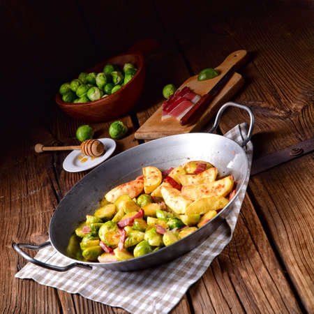 Brussels Sprouts with ham ,honey and roasted potatoesの写真素材