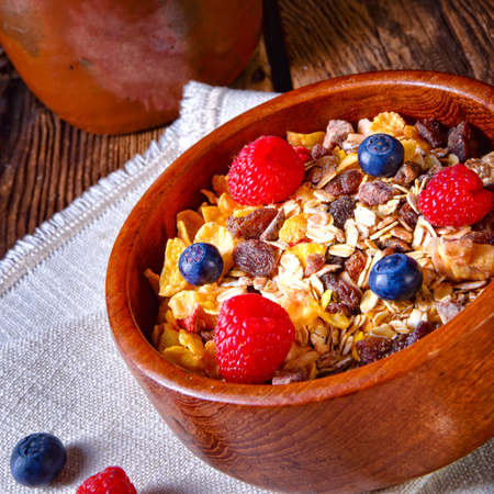 rustic muesli breakfast with forest fruits