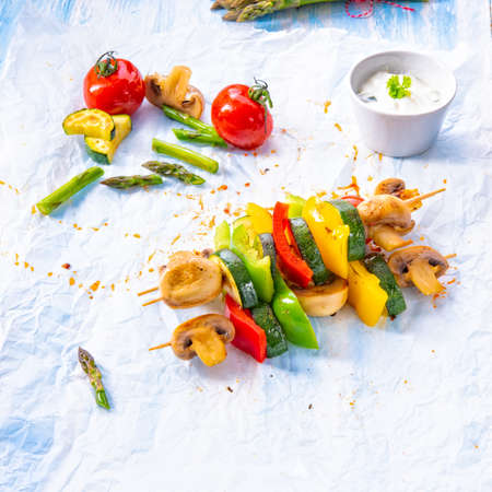 vegetarian skewers white mushrooms, peppers and zucchini for barbecueの写真素材